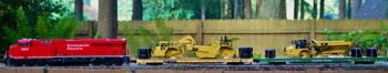  Caterpillar Loads on Flatcars (from Ralphstrains, LLC) pulled by CP 4400AC 
